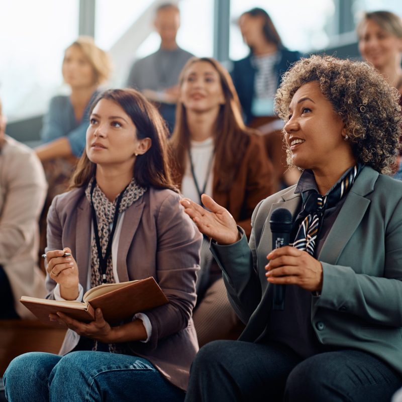 female-manager-asking-question-from-the-audience-w-2024-12-13-19-29-15-utc-min